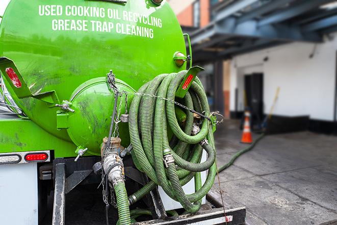 grease trap pumping equipment in action in Pico Rivera CA